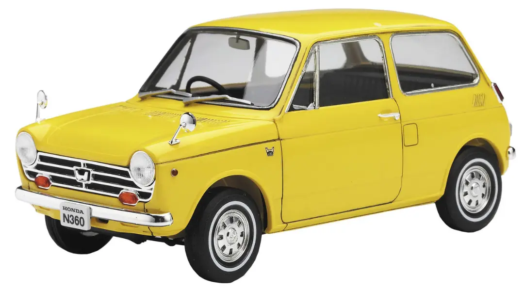 خودرو هوندا N360 (Honda N360) زرد رنگ در نمای سه چهارم