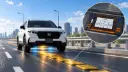خودروی برقی هوندا (Honda) در حال عبور از روی پدهای شارژ بی‌سیم جاده