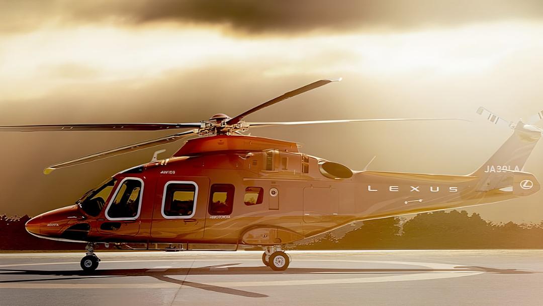 بالگرد لکسوس مدل لئوناردو AW169 با بدنه قرمز در فرودگاه