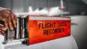 جعبه سیاه هواپیما (Flight Data Recorder) با بدنه نارنجی پررنگ