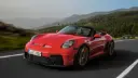 خودروی قرمز پورشه 911 GT3 S/C (Porsche 911 GT3 S/C) در حال حرکت در جاده