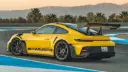 خودرو زرد رنگ پورشه (Porsche) مدل GT3 RS در پیست مسابقه