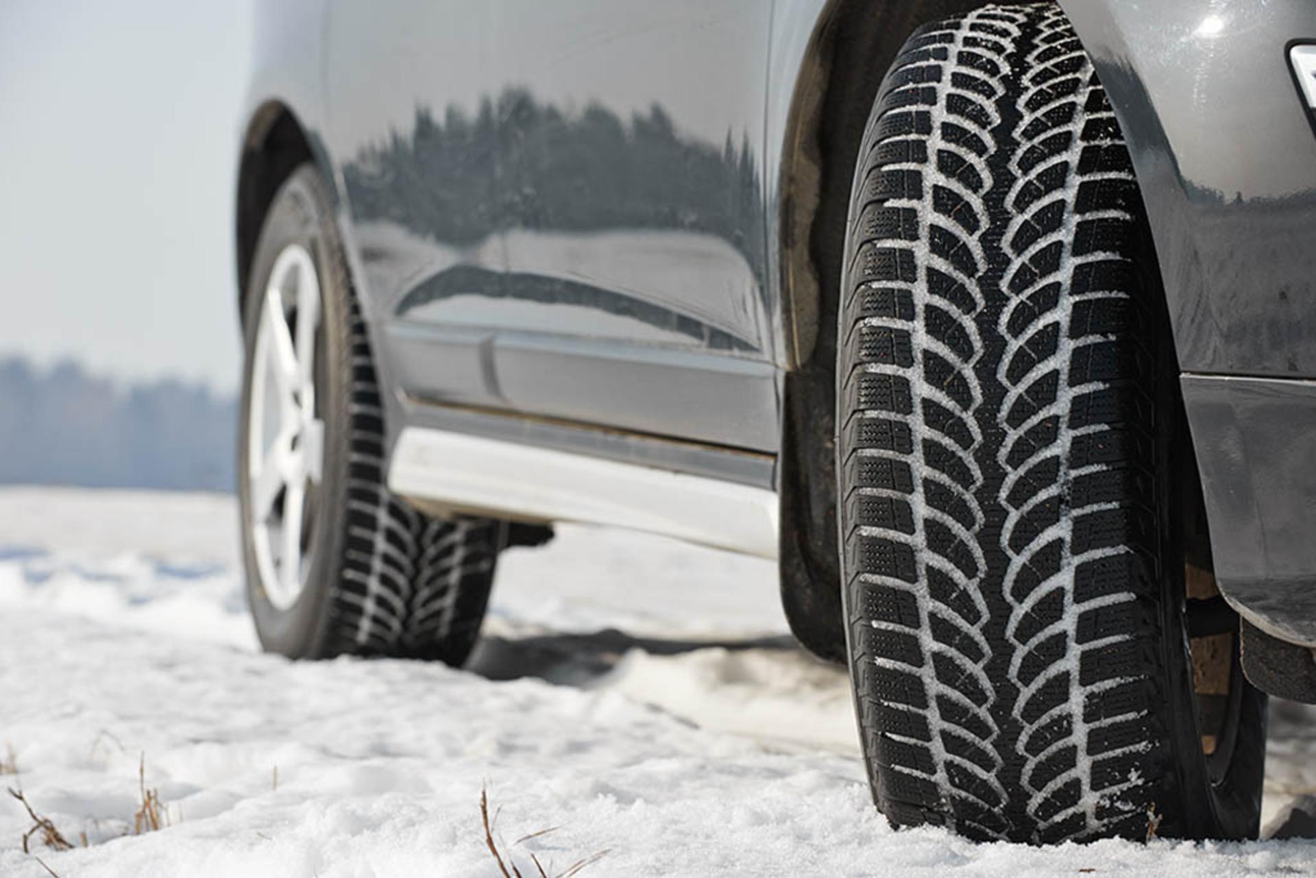 Winter tyres wheels installed on suv car outdoors