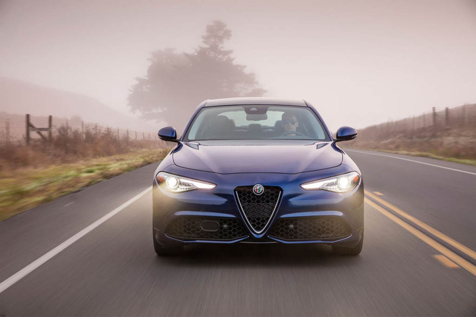 2017-alfa-romeo-giulia-ti-front-view-in-motion-03