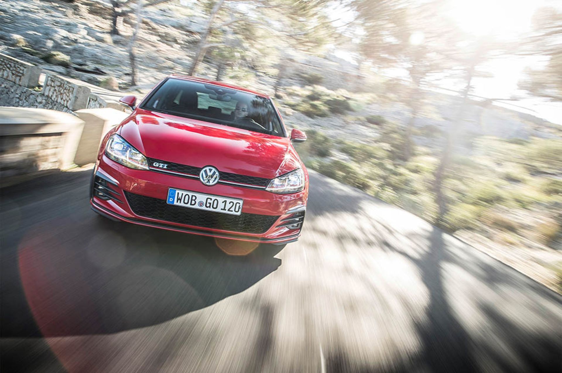 2018-Volkswagen-Golf-GTI-European-Spec-front-view-in-motion-01