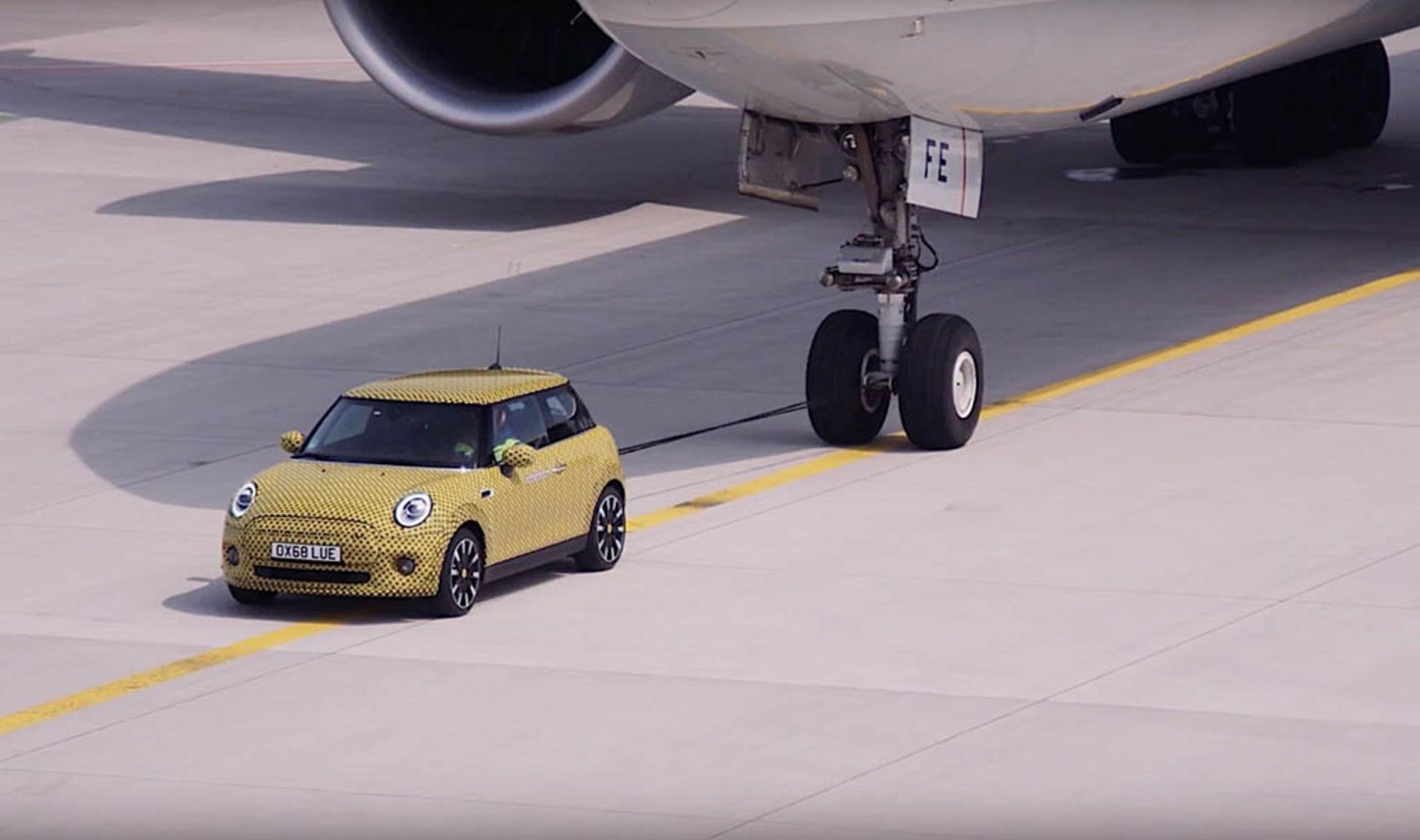 2020-mini-cooper-se-flexes-muscles-and-tows-a-boeing-777f-down-a-runway_8