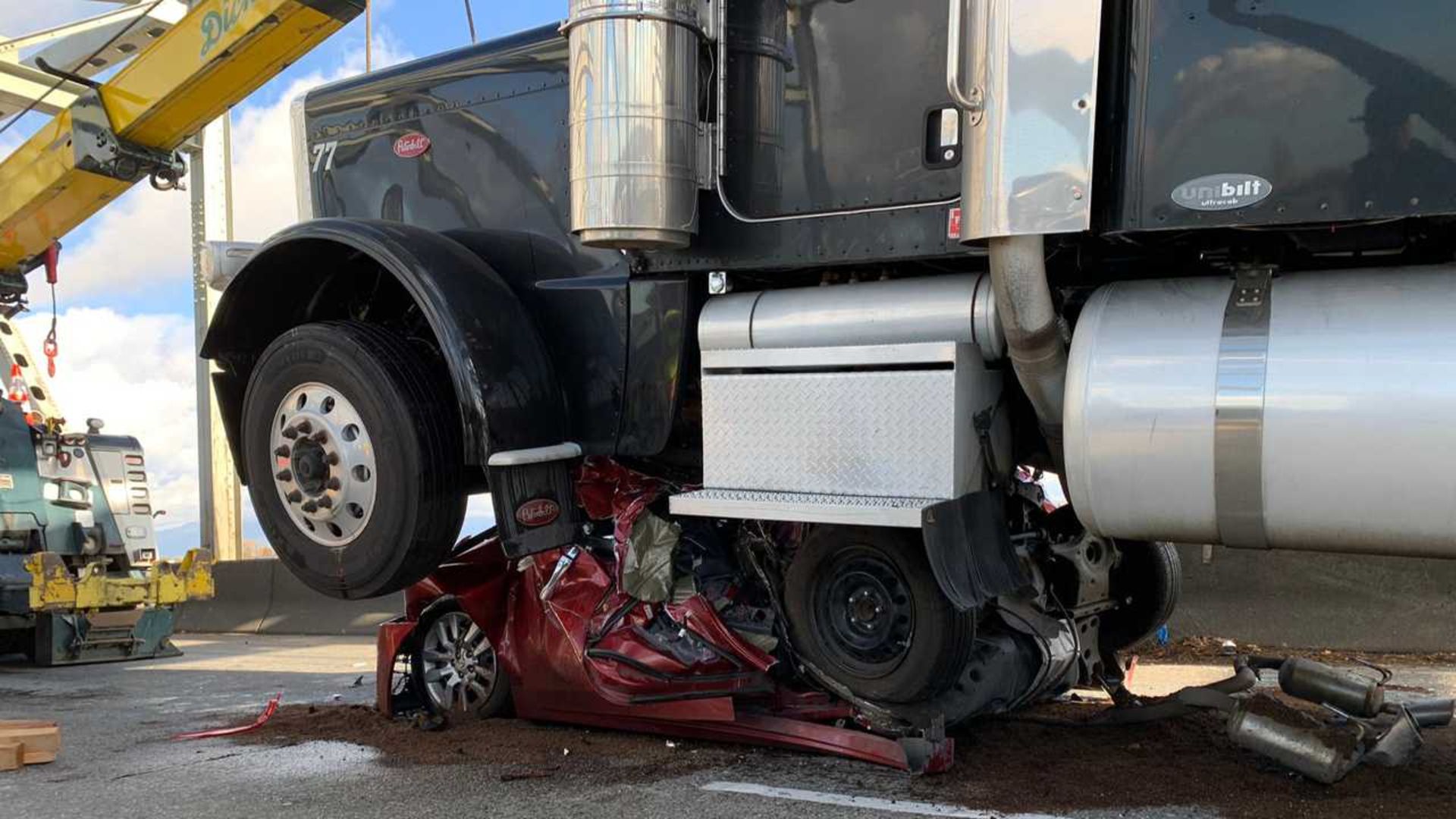 car-crushed-by-semi-truck