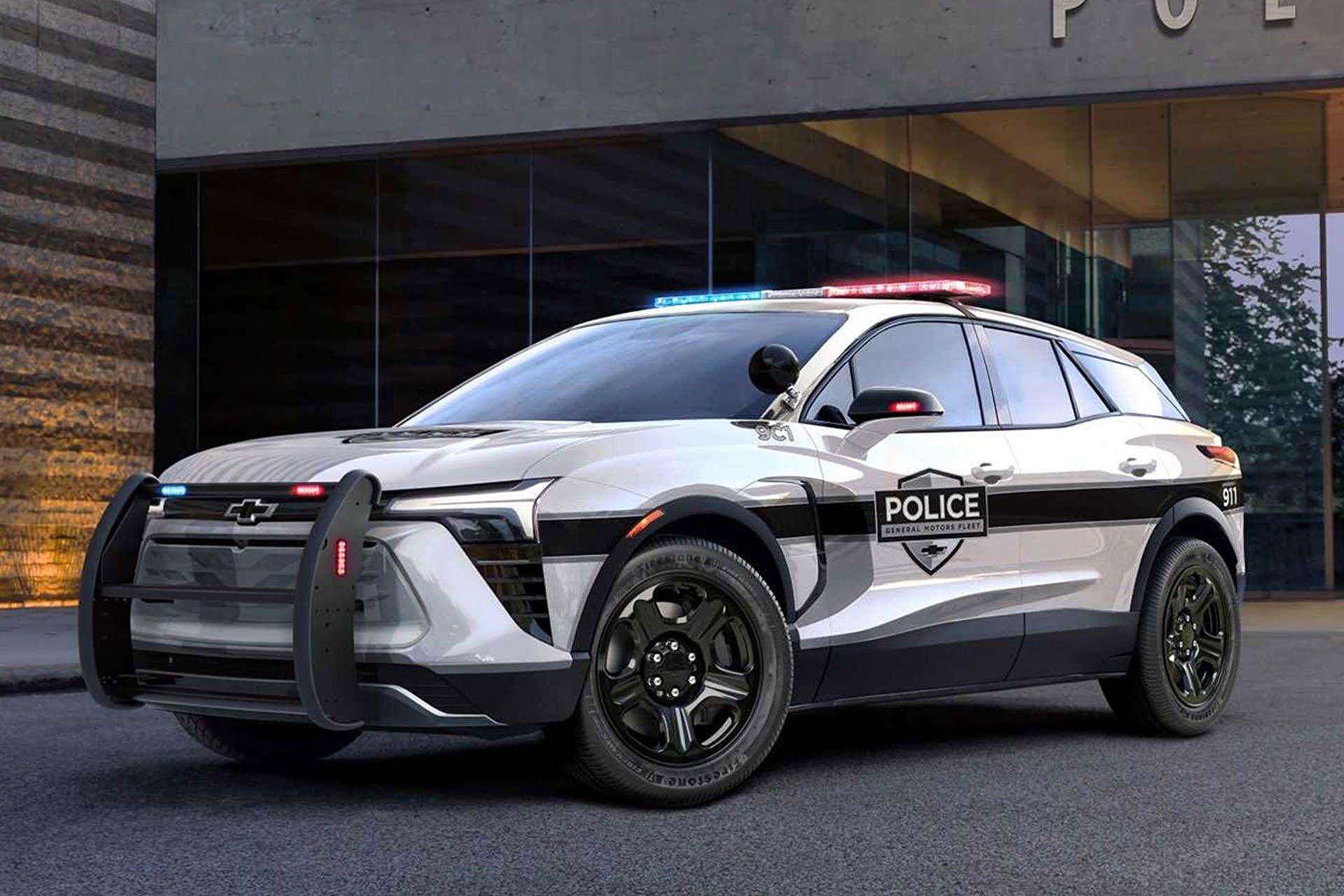 2024-chevrolet-blazer-ev-police-pursuit-vehicle-exterior-front-three-quarter-view-outside-police-station