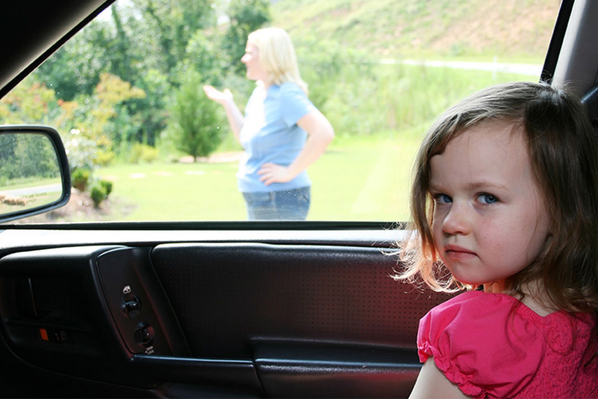 Kid in car distracted parent iStock
