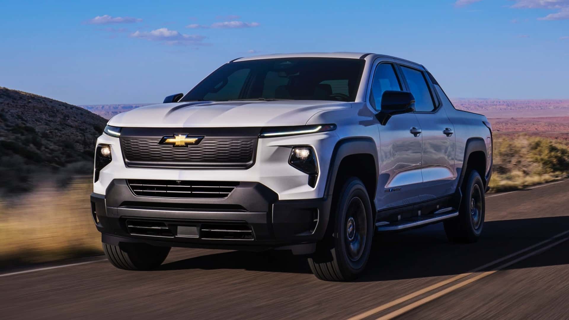 2024-chevrolet-silverado-ev-work-truck-exterior-front-quarter-view-driving