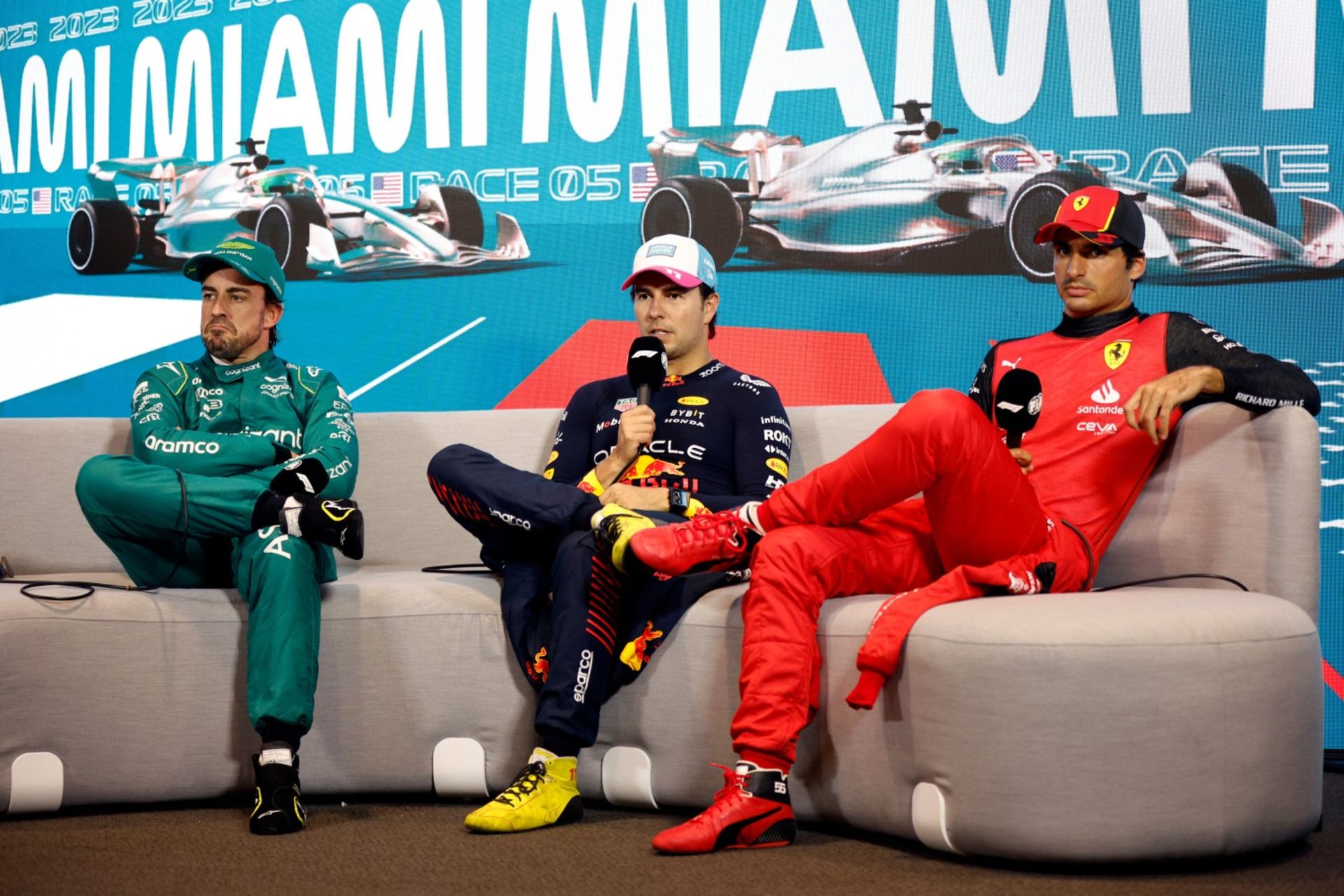 MIAMI, FLORIDA - MAY 06: Pole position qualifier Sergio Perez of Mexico and Oracle Red Bull Racing (C), Second placed qualifier Fernando Alonso of Spain and Aston Martin F1 Team (L) and Third placed qualifier Carlos Sainz of Spain and Ferrari (R) attend the press conference after qualifying ahead of the F1 Grand Prix of Miami at Miami International Autodrome on May 06, 2023 in Miami, Florida. (Photo by Jared C. Tilton/Getty Images) // Getty Images / Red Bull Content Pool // SI202305070009 // Usage for editorial use only //