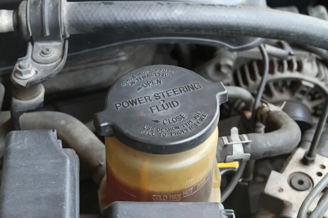 bigstock-Power-Steering-Fluid-Cap-50244443