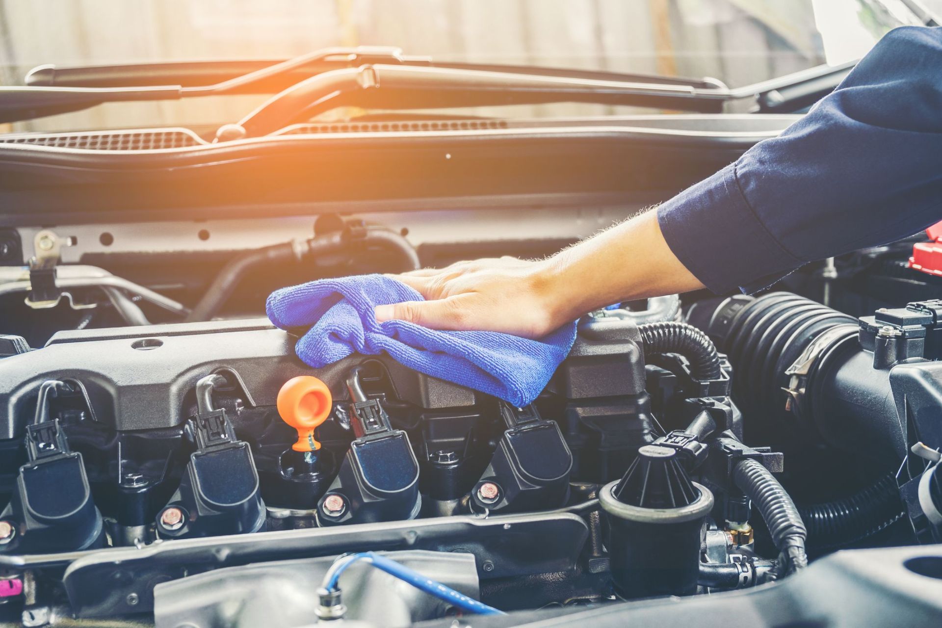 cropped-of-mechanic-cleaning-car-engine-royalty-free-image-944169048-1554929384