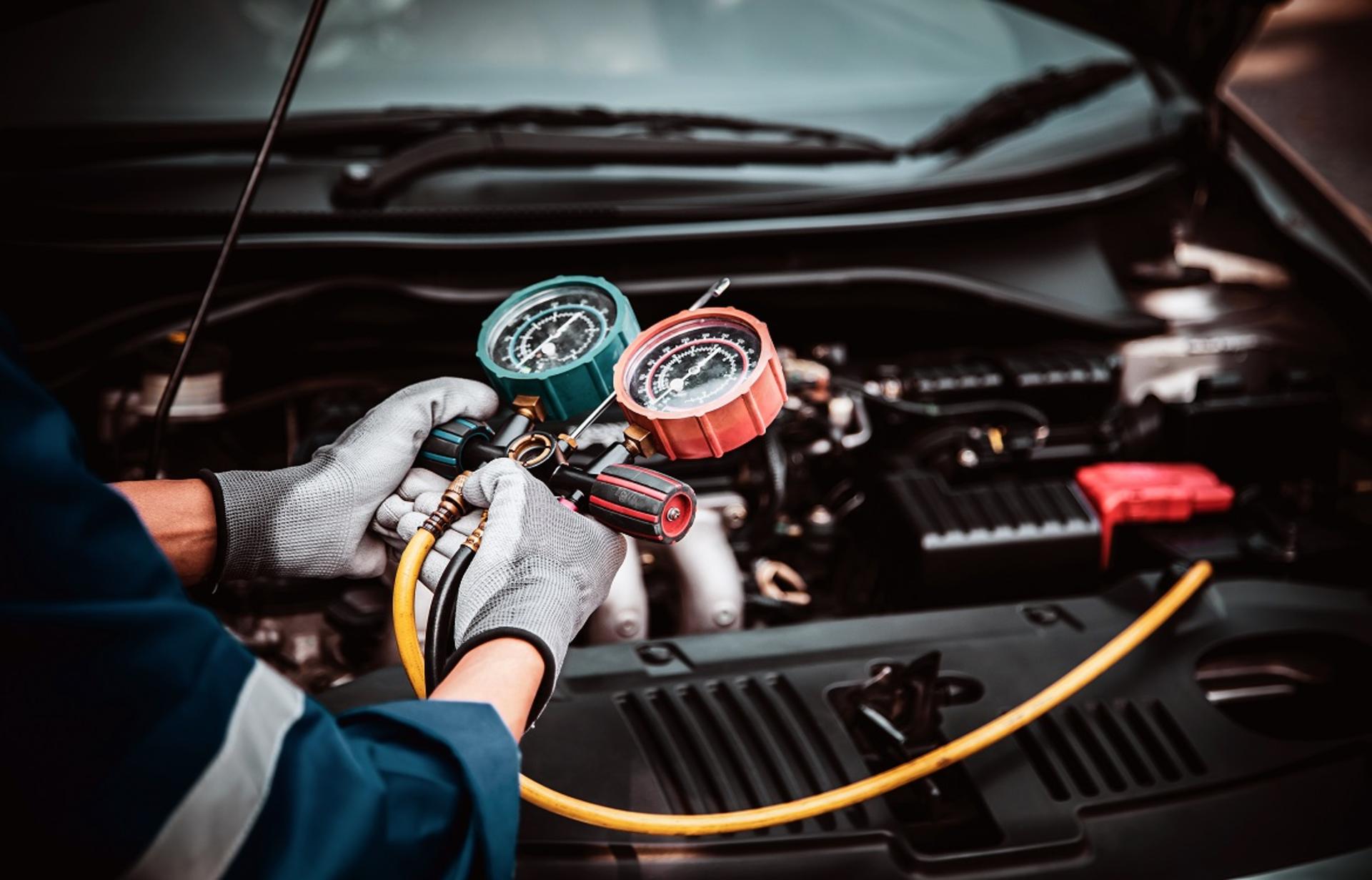 close-up-hand-auto-mechanic-using-measuring-manifold-gauge-check-refrigerant-filling-car-air-conditioner-fix-checking-repair-service-support-maintenance-car-insurance