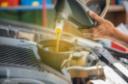 man-pouring-oil-into-car-royalty-free-image-1598901693