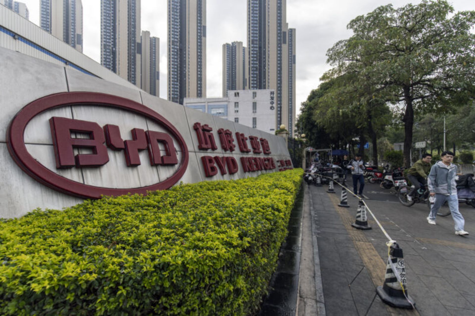 Signage at the BYD Co. Kengzi battery production facility in Shenzhen, China, on Wednesday, Jan. 17, 2024. BYD, the world's largest maker of electric vehicles, will invest 100 billion yuan ($14 billion) to develop smart-car features, its founder and chief executive officer said Tuesday. Photographer: Qilai Shen/Bloomberg via Getty Images