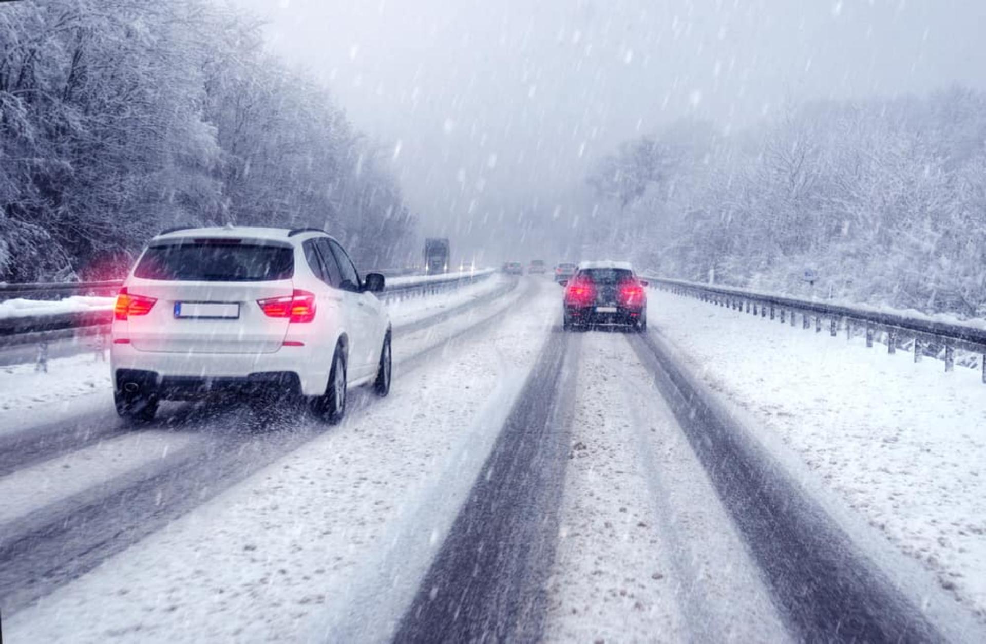 Cars-and-SUVs-Driving-on-a-Highway-in-Snow