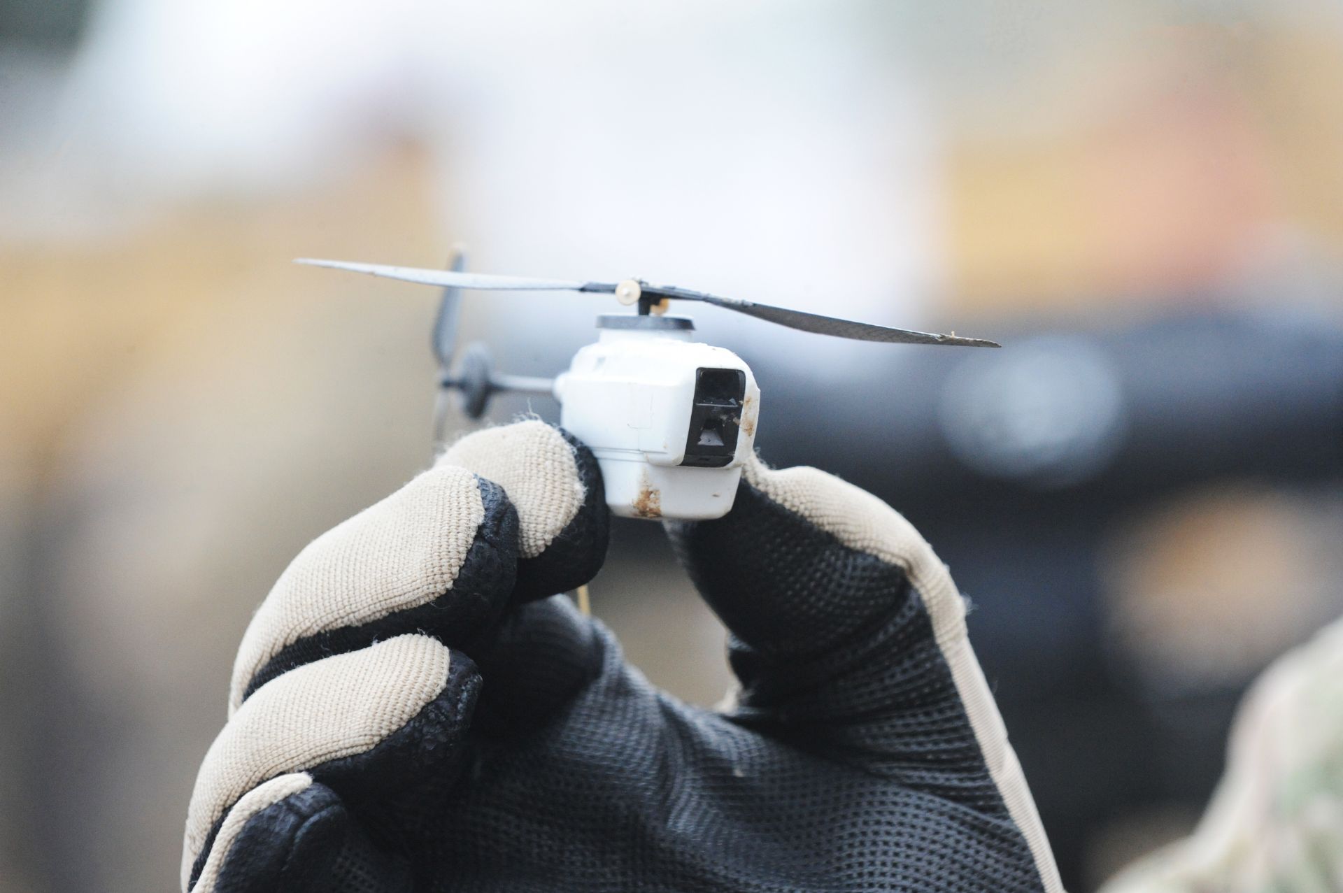 A Black Hornet nano helicopter unmanned aerial vehicle (UAV).

The Black Hornet Nano Unmanned Air Vehicle measures around 4 inches by 1 inch (10cm x 2.5cm) and provides troops on the ground with vital situational awareness.

The Black Hornet is equipped with a tiny camera which gives troops reliable full-motion video and still images. Soldiers are using it to peer around corners or over walls and other obstacles to identify any hidden dangers and the images are displayed on a handheld terminal.